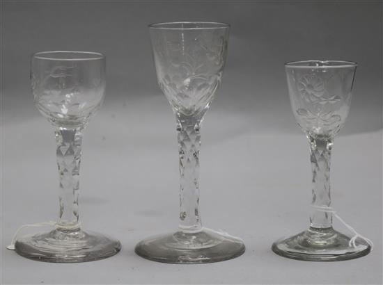 Three early 18th century facet stem rose engraved glasses